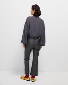 grey trumpet-shaped eco-leather trousers