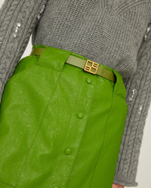 green eco-leather skirt with maxi pockets