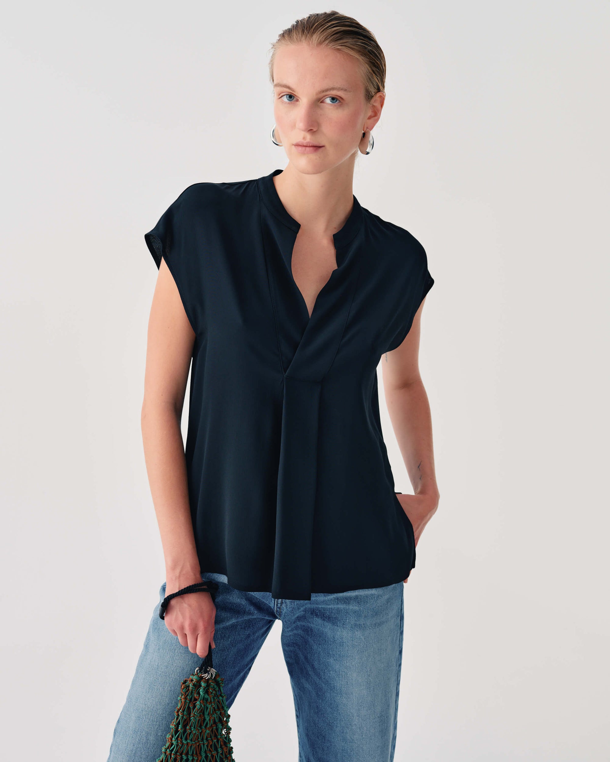 SLEEVELESS SHIRT WITH DRAPED DETAIL