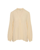 BLUSA FLUIDA CON SCOLLO A V